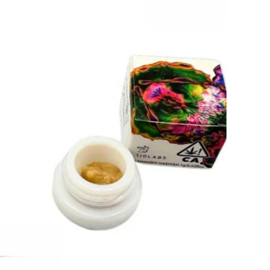 Cannabis product in a container with colorful packaging on a white background