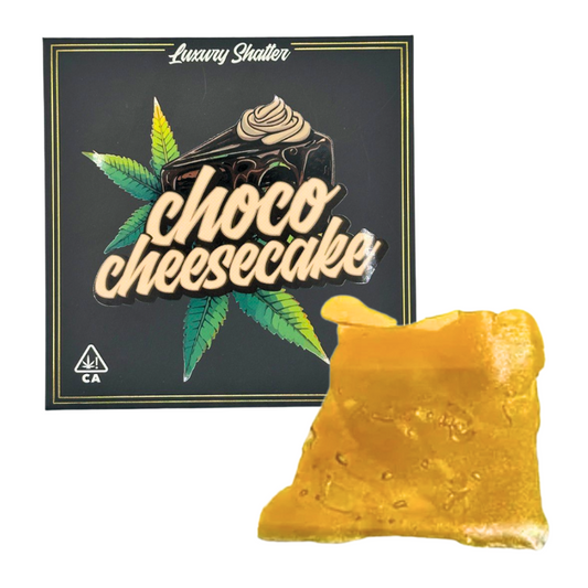 Luxury Shatter packaging for choco cheesecake flavor with a piece of cannabis resin in front.