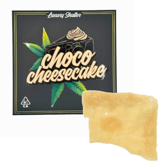 Choco Cheesecake Luxury Shatter cannabis concentrate – premium amber shatter with rich chocolate cheesecake flavor profile, displayed with branded packaging and CA compliance label.