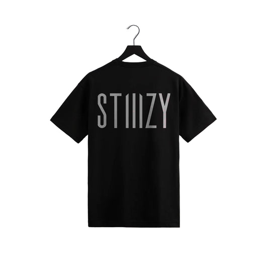 STIIIZY black t-shirt with bold vertical logo design, modern streetwear cannabis lifestyle apparel displayed on hanger against neutral background.